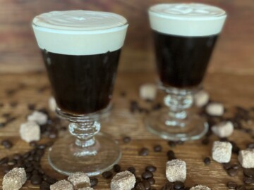 two Irish Coffees with sugar cubes