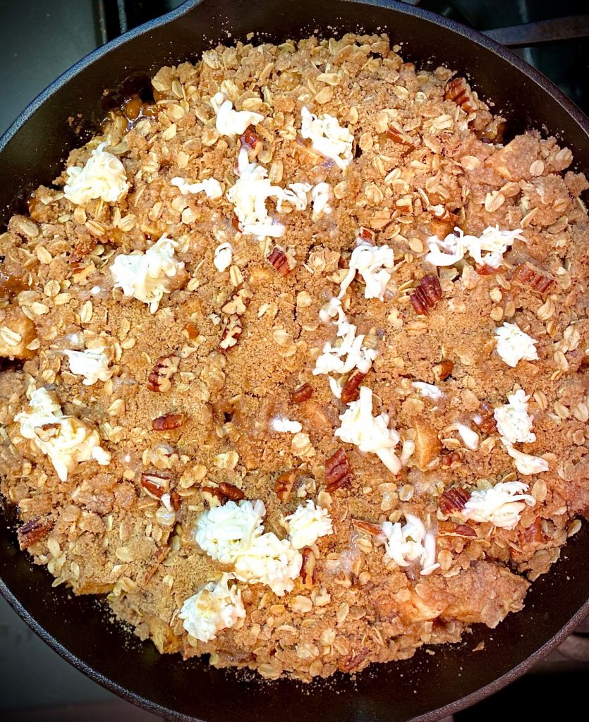 Grate butter on topping