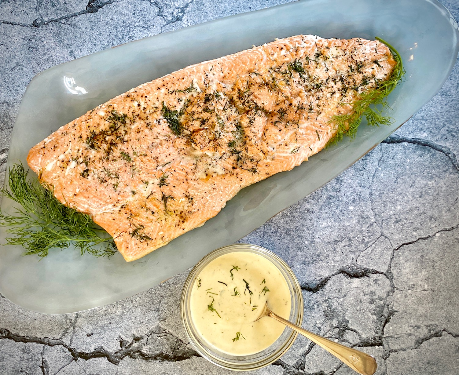 Baked Salmon and bowl of sauce