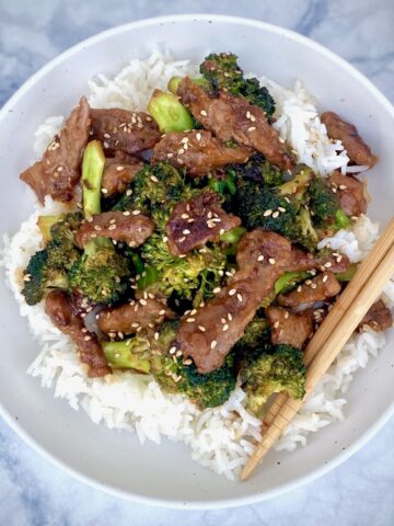 Beef Broccoli over rice in white bowl