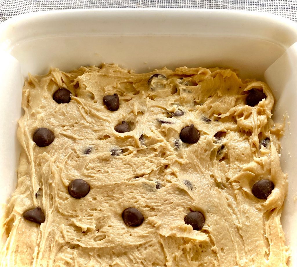 Blondies batter in pan with Choc Chips to bake