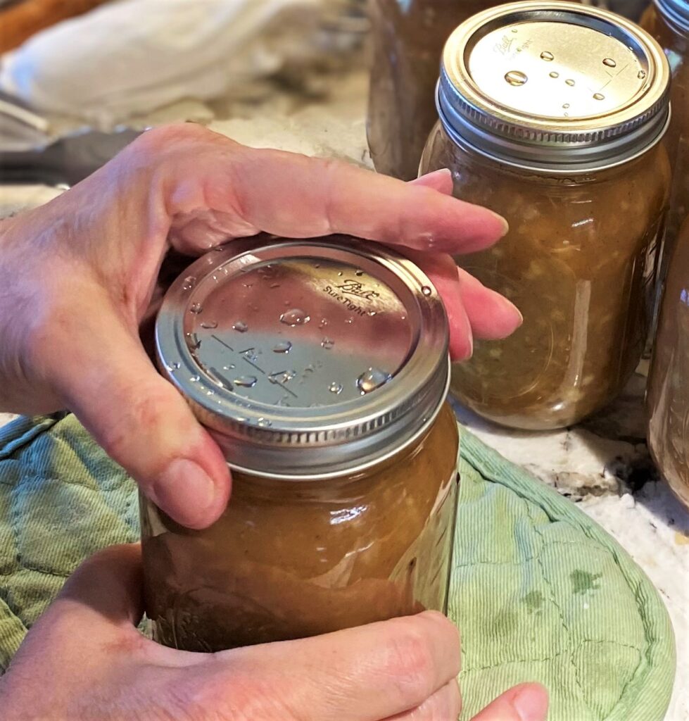 Add band to canning jar