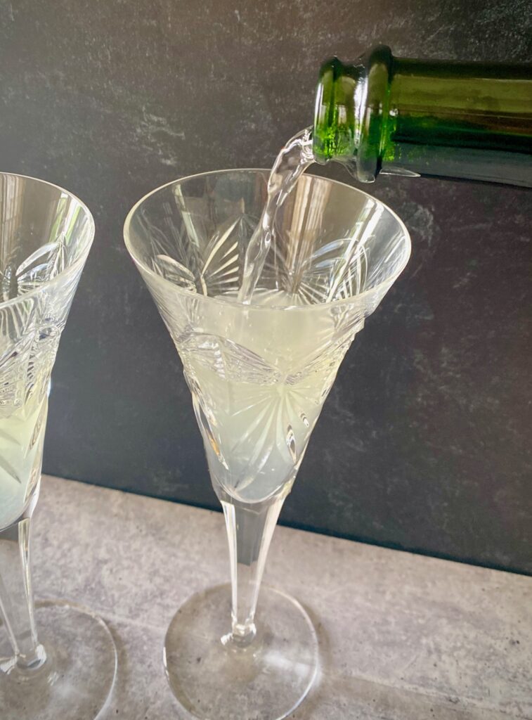Pouring champagne into a glass