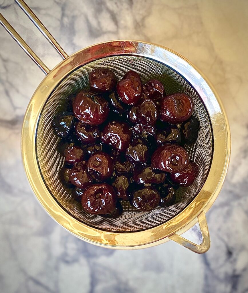 Cherries in a strainer