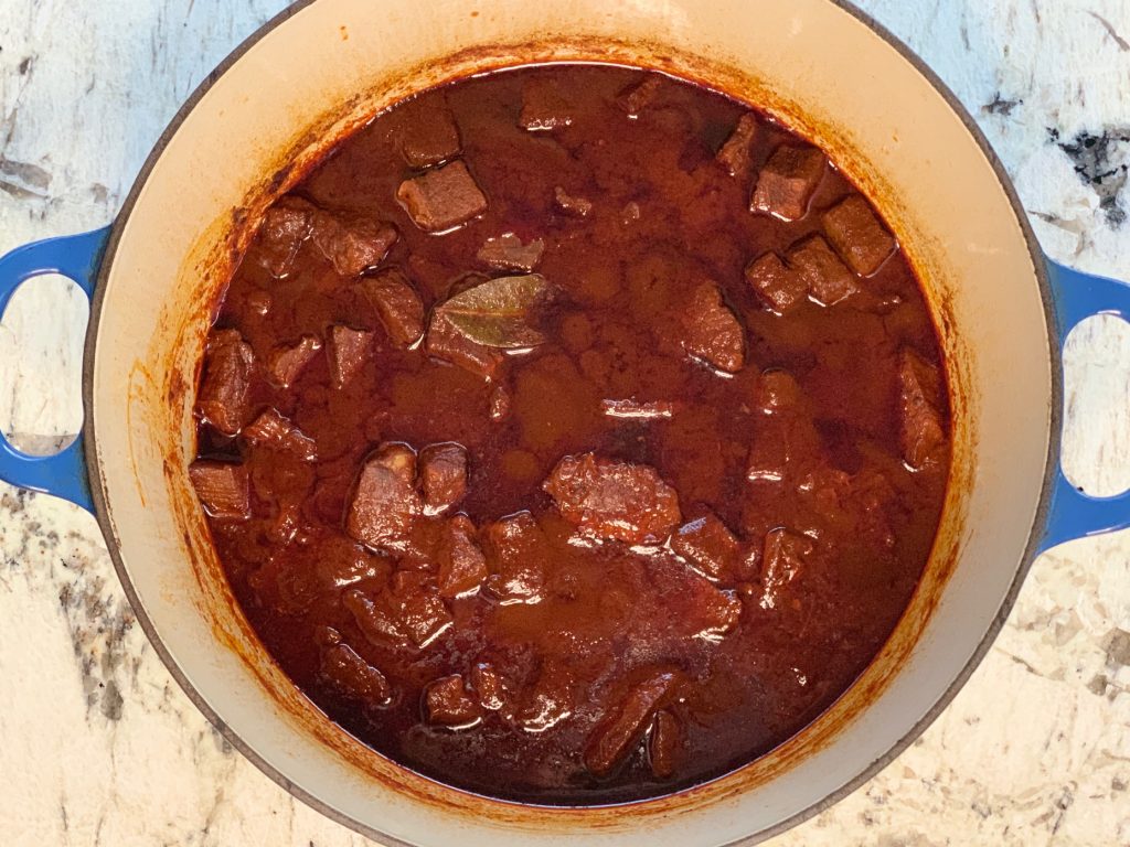 Chile Colorado cooked in a Dutch oven pan