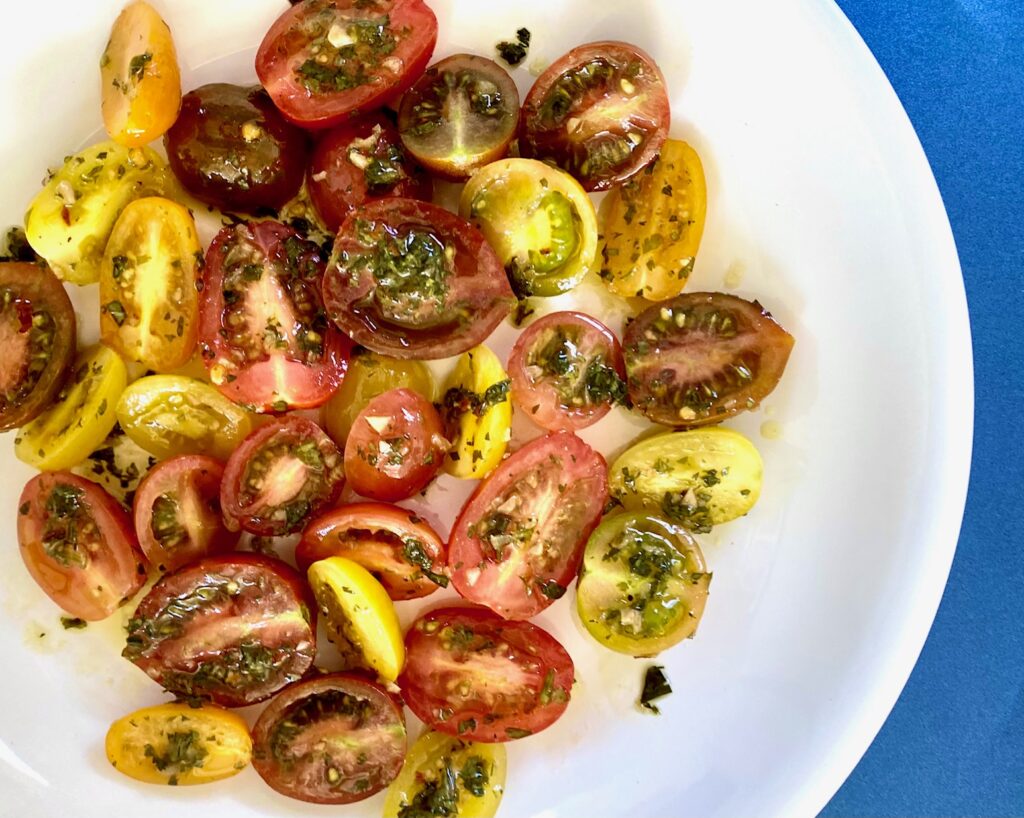 Chimichurri cherry tomatoes in white bowl 