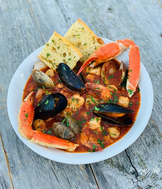 Cioppino in a white bowl
