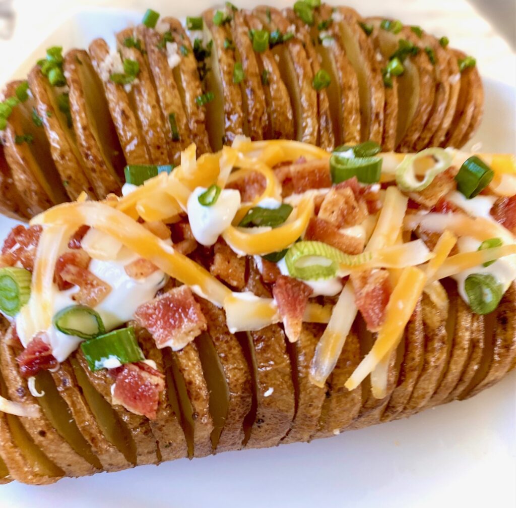 2 loaded cut Potatoes with bacon, chives, sour cream and cheese
