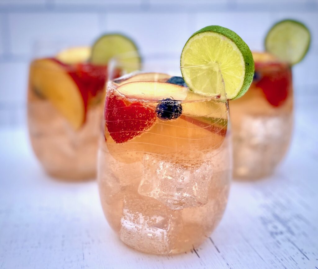 glasses of white sangria with fruit