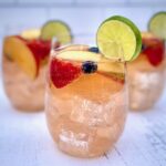 glasses of white sangria with fruit