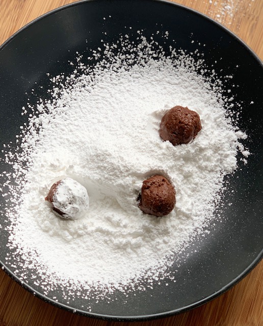 Crinkle dough rolled in powdered sugar
