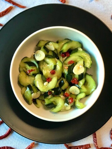 Asian Cucumber Salad in black bowl