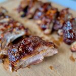 a platter of baby backs with sauce