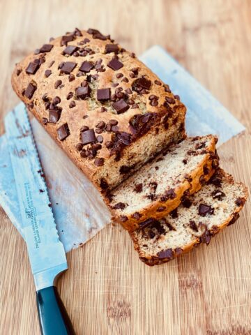full loaf banana bread with knife