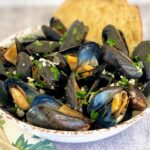 garlic bread and mussels in a bowl