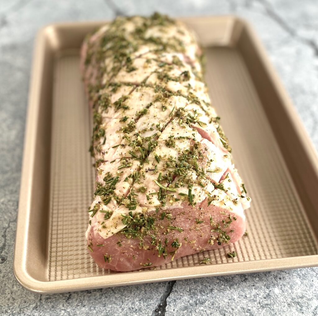 herb coated roast on sheet pan