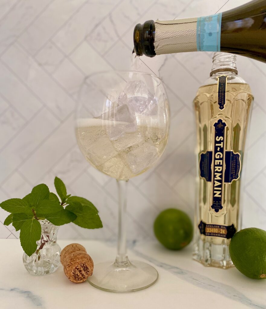 pouring prosecco into a wine glass