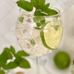 a single Hugo Spritz with garnish
