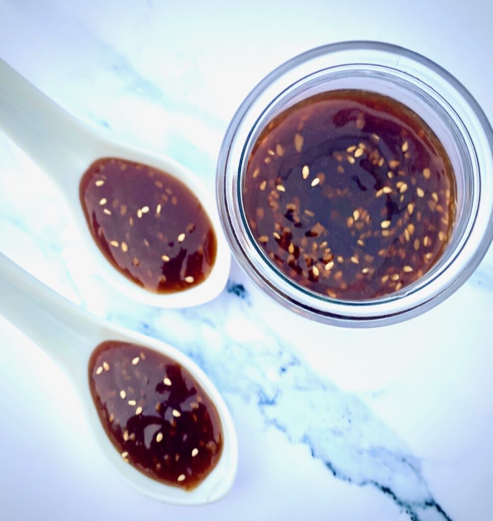 teriyaki sauce in a jar and on spoons