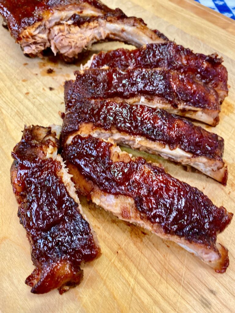 oven baked ribs on a cutting board
