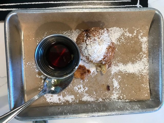 bacon beignets with maple syrup
