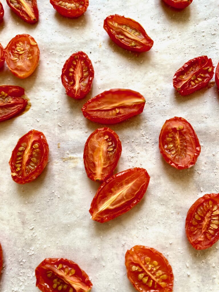 cherry tomatoes on parchement paper