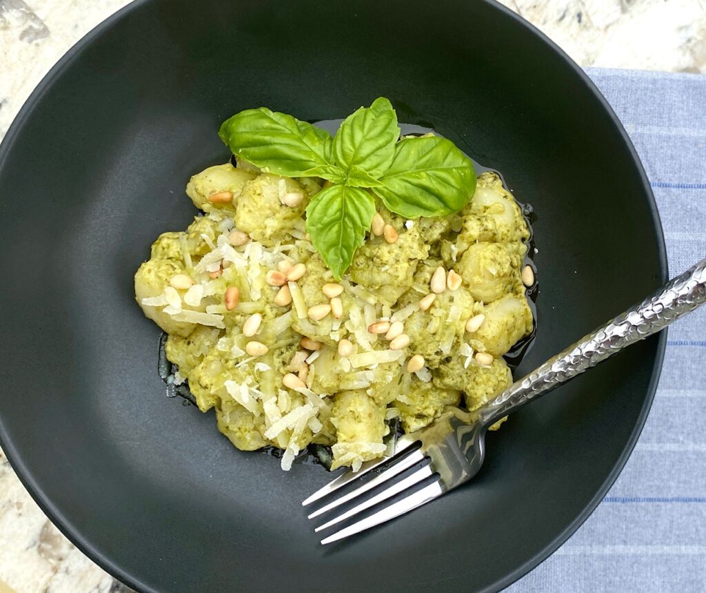 black bowl with pesto gnocchi