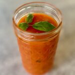 Jar of marinara with basil leaf