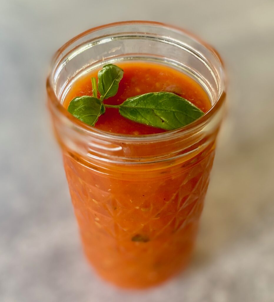 Jar of marinara with basil leaf