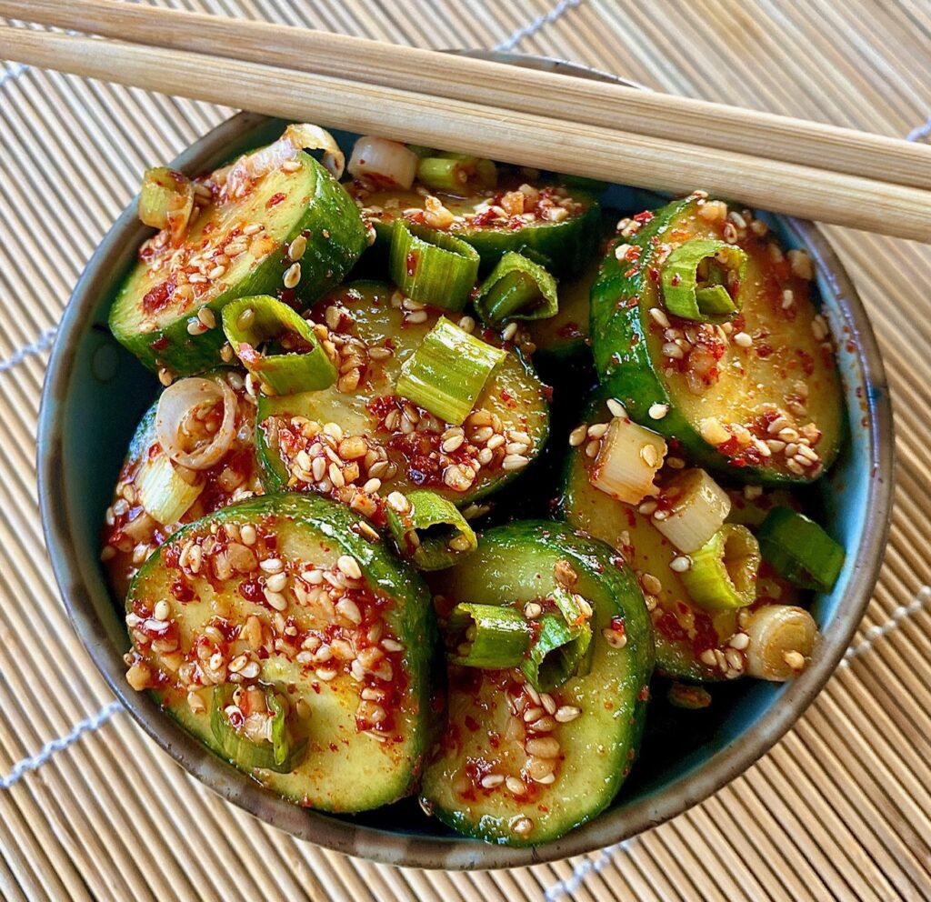Korean Cucumbers in bowl with chopsticks