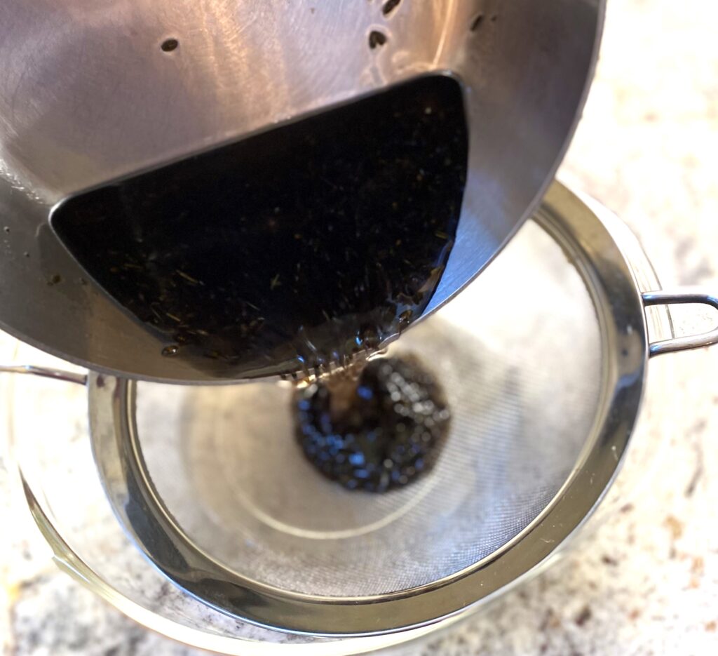 straining lavender syrup