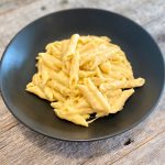 Mac n cheese in a black bowl