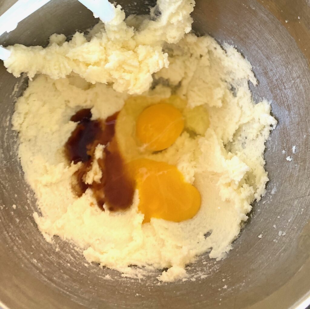 Mixing bowl with batter and vanilla and eggs