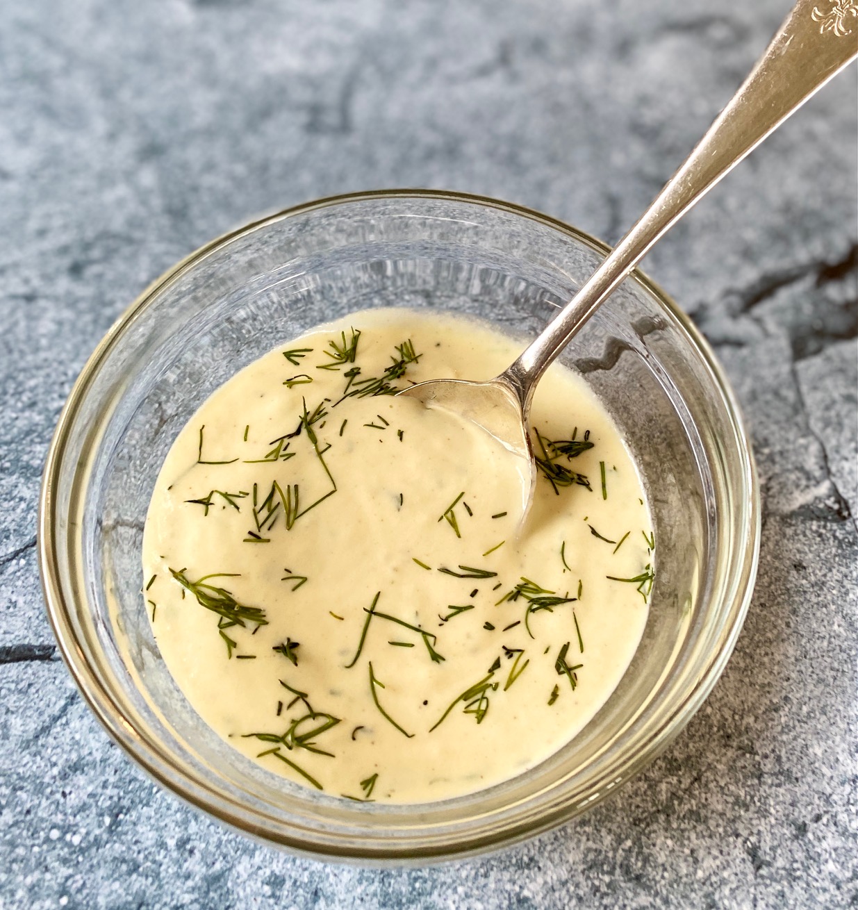 a bowl of Mustard Dill sauce with spoon