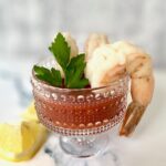 3 jumbo prawns in glass with seafood sauce