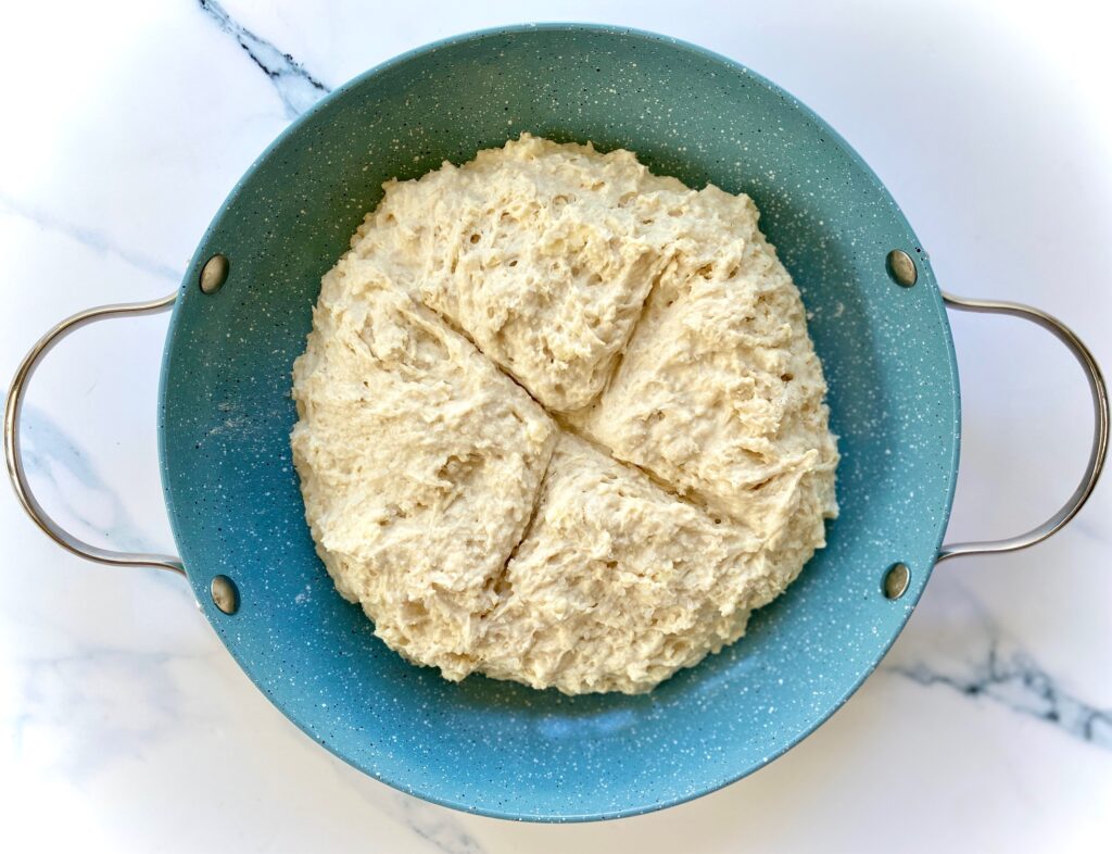 Pan of dough with X across top