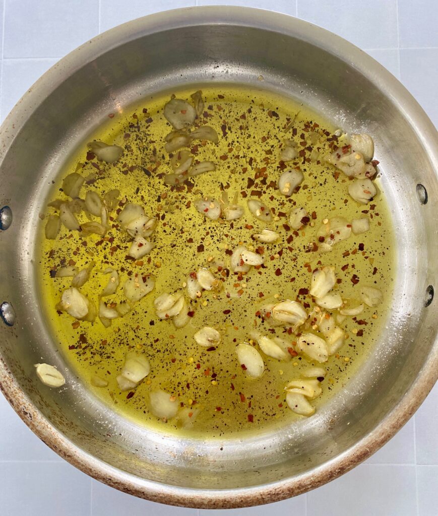 pan of oil, garlic, red pepper flakes