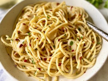 pasta aglio e olio in a bowl with a fork