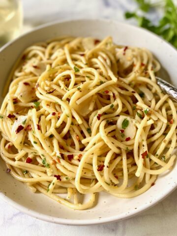 pasta aglio e olio in a bowl with a fork