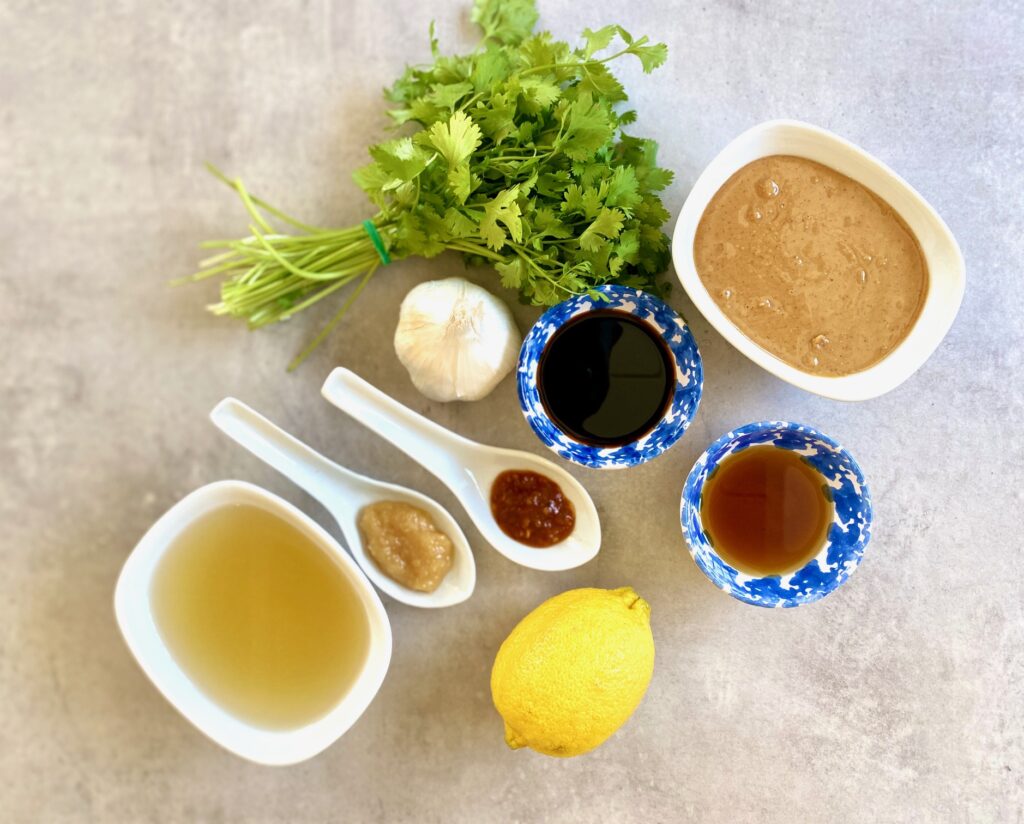 ingredients for peanut sauce in small cups