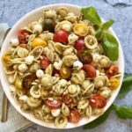 A bowl of pesto pasta salad
