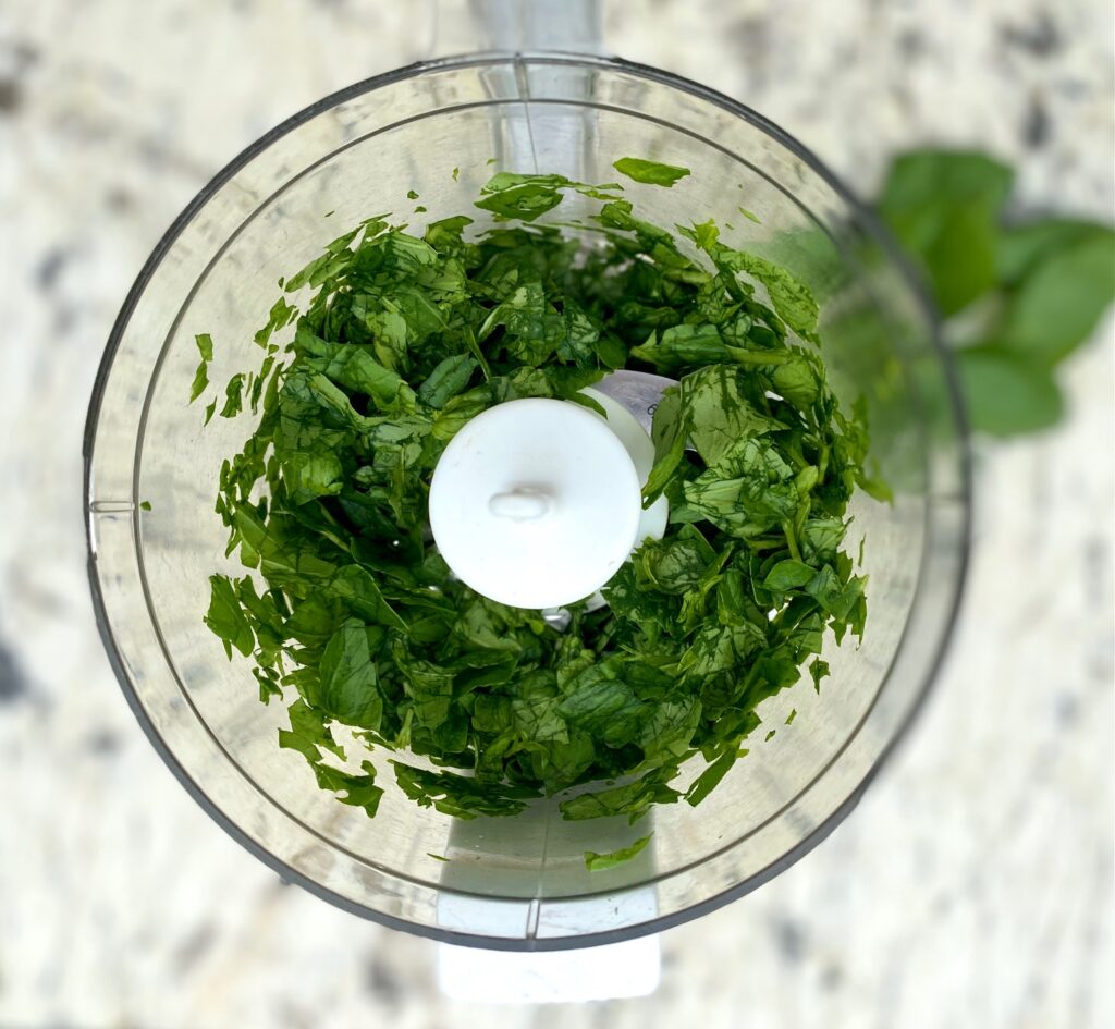 chopped basil in a food processor