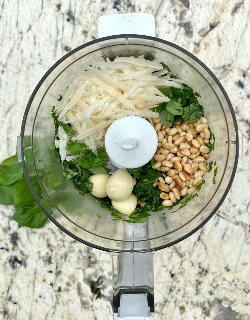 basil, pine nuts, garlic, parmesan in a chopper