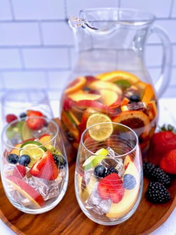pitcher and glasses of fruit