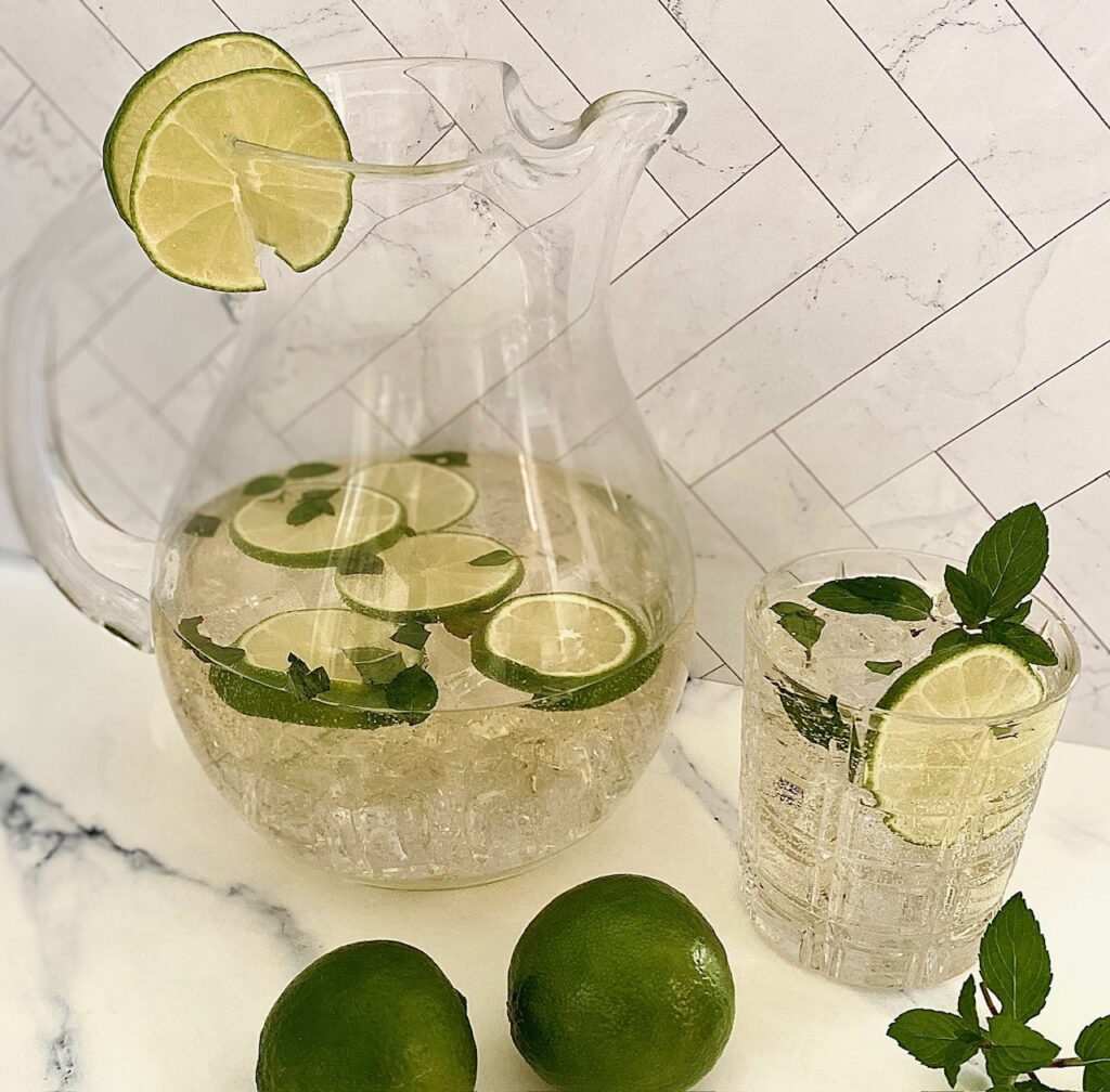 a pitcher of Hugo spritz and a single cocktail