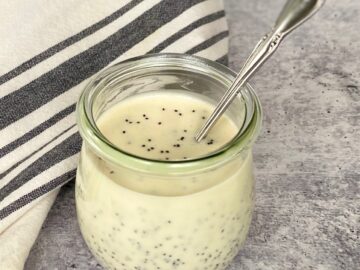Poppy seed dressing in jar with a spoon