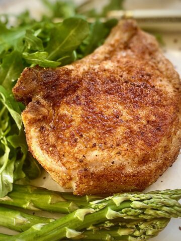 seasoned chops with green vegetables