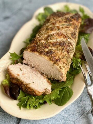 roast pork loin on a cream platter