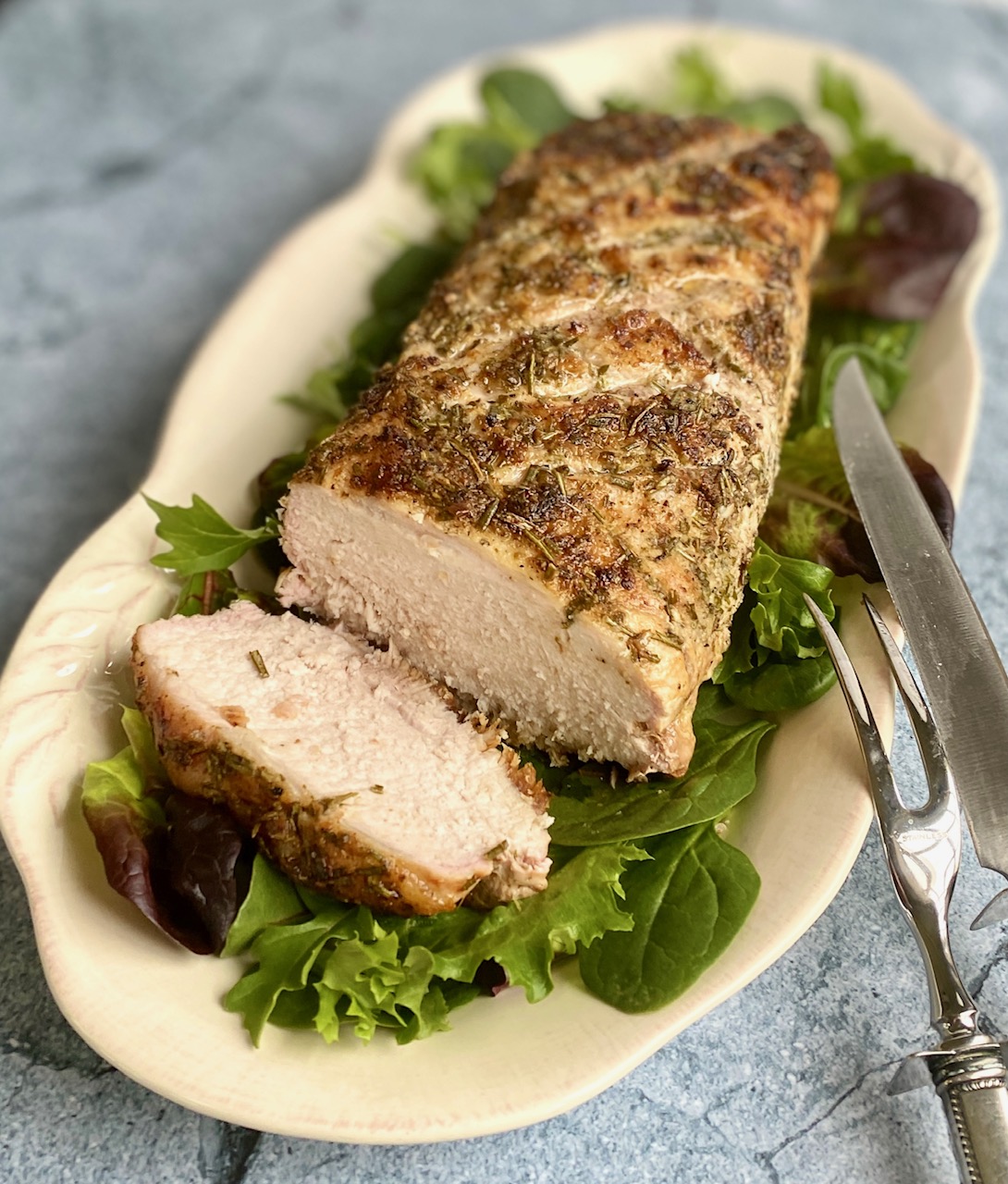 roast pork loin on a cream platter