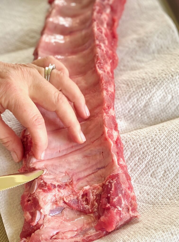 using a knife to remove rib membranes